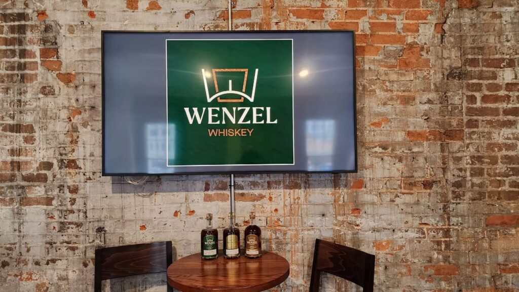 Wenzel Whiskey and brick wall