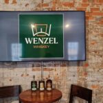 Wenzel Whiskey and brick wall