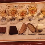 chocolates and Glencairn glasses with bourbon